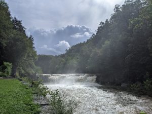 Misty River with Storm Clouds in Summer